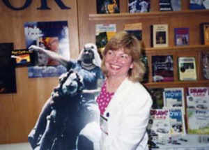 Susan Joyce in 1990 with a cutout photo of her inspirational Aunt Gladys riding a camel