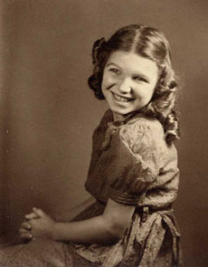 Sepia-toned photo of young Susan with long curly hair.